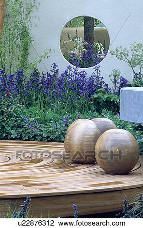 Wooden globe sculpture on circular decking in modern garden View Large Photo Image Stock Image - Wooden globe sculpture on circular decking in modern garden. Fotosearch