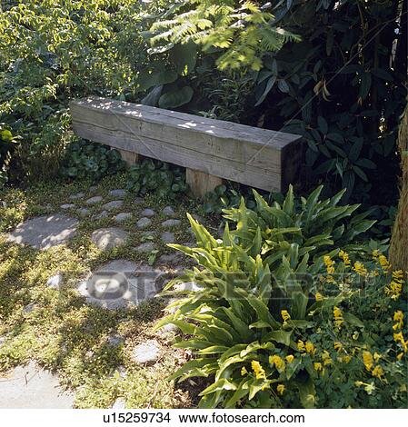 Wooden sleeper bench in country garden in summer View Large Photo Image Picture - Wooden sleeper bench in country garden in summer. Fotosearch