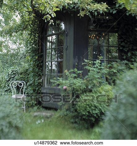 Wooden summerhouse in country garden View Large Photo Image Stock Image - Wooden summerhouse in country garden. Fotosearch