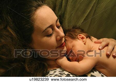 Stock Photo -  baby child 01 month 30-35 years affection bonding. Fotosearch