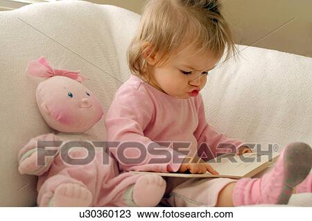 baby girl child book kid 12 years 6-12 months View Large Photo Image Stock Image - baby girl child book kid 12 years 6-12 months. Fotosearch