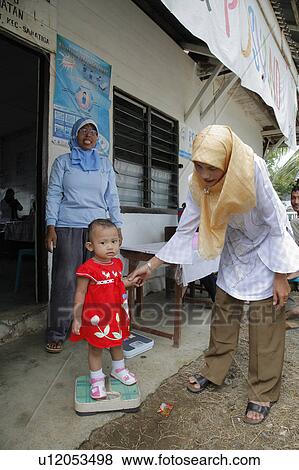 Stock Photo -  baby people person indonesia growth monitoring . Fotosearch