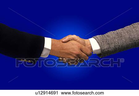 Stock Image -  background business hand two shaking hands blue . Fotosearch