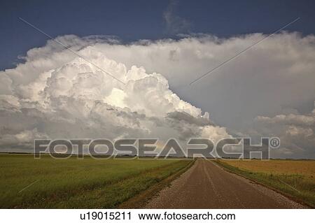 Stock Image -  background summer country road clouds in storm . Fotosearch