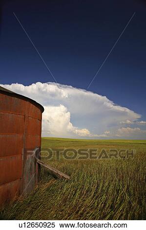 Stock Photography -  background summer wooden granary clouds in storm . Fotosearch