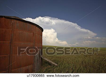 background summer wooden granary clouds in storm View Large Photo Image Stock Photography - background summer wooden granary clouds in storm . Fotosearch