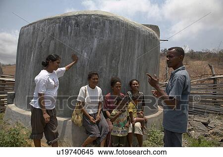 Stock Photography -  background water women timor leste aid workers. Fotosearch