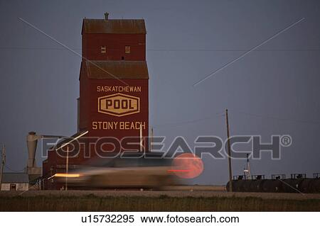 beach art full moon rising stoney grain elevator View Large Photo Image Stock Photography - beach art full moon rising stoney grain elevator . Fotosearch