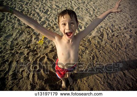 beach child 7-9 years arms raised body language View Large Photo Image Stock Photo - beach child 7-9 years arms raised body language. Fotosearch