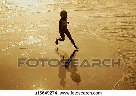 beach girl pattern reflection running in sea View Large Photo Image Picture - beach girl pattern reflection running in sea . Fotosearch