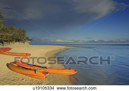 Picture -  beach water kayaks korolevu fiji islands sand. Fotosearch