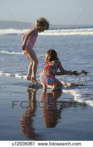 beach water pattern children reflection girls View Large Photo Image Stock Image - beach water pattern children reflection girls . Fotosearch