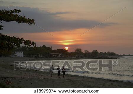Picture -  beach water timor leste sunset east asia south. Fotosearch