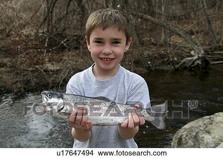 Picture -  boy trout tyler stone fishing new hampshire mr. Fotosearch