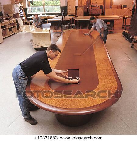 Stock Image -  business finishing polishing furniture wood desk . Fotosearch