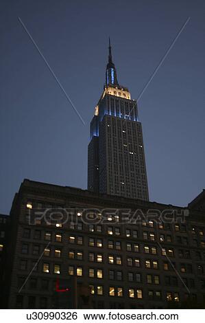 Stock Photograph -  business office empire state building night new. Fotosearch