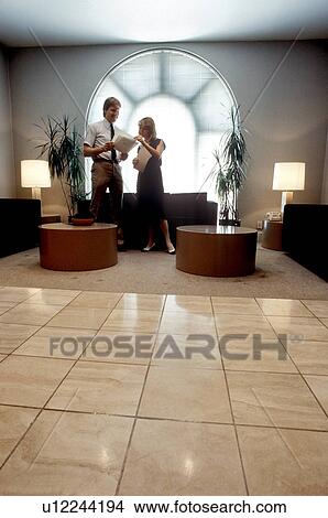 Picture -  business people office person discussing plans . Fotosearch