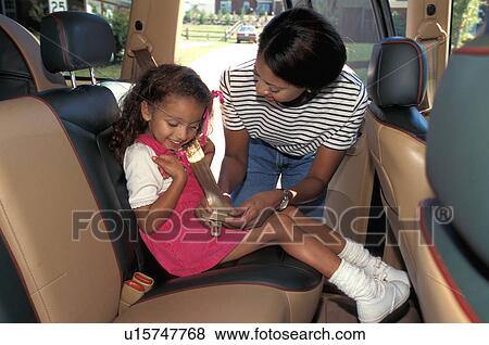 car girl child kid, 30-35 years woman View Large Photo Image Stock Photo - car girl child kid, 30-35 years woman . Fotosearch