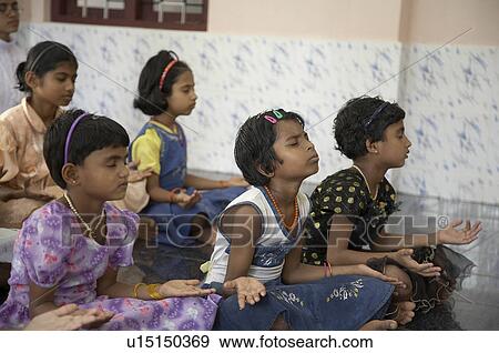 Stock Photo -  child children india girls prayer mary matha run . Fotosearch