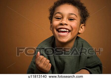 Stock Image -  child face kid 5-6 years 7-9 boy brunette cheerful. Fotosearch