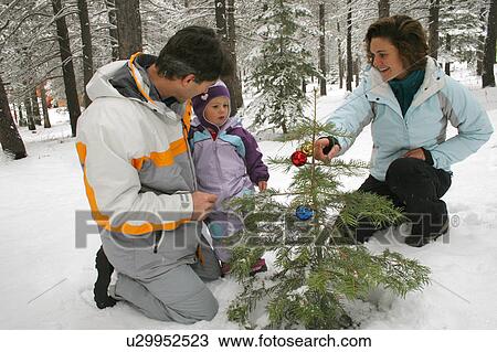 christmas family tree couple child 25-30 years 34 View Large Photo Image Stock Image - christmas family tree couple child 25-30 years 34. Fotosearch