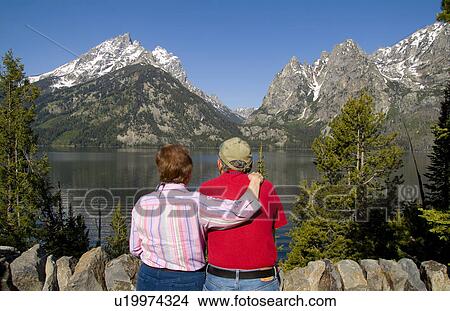 couple beauty retired senior relaxing lake grand View Large Photo Image Picture - couple beauty retired senior relaxing lake grand. Fotosearch