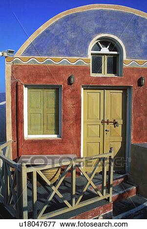 Stock Photo - design art home colorful red blue shop porch oia santorini island, greece. Fotosearch