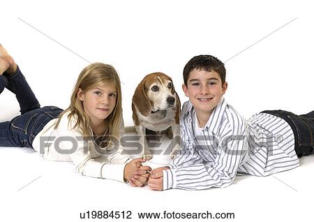 Stock Image -  dog girl child face children boy pet beagle 2. Fotosearch