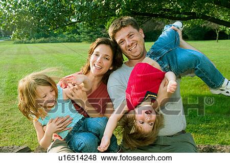 Stock Photo -  family children 30-35 years 3-4, 56, affection. Fotosearch