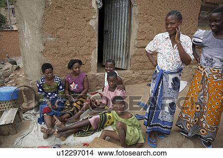 Picture -  family woman people house person children women. Fotosearch