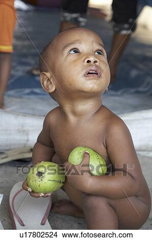 Picture -  food people child children timor leste camp for internally displaced. Fotosearch