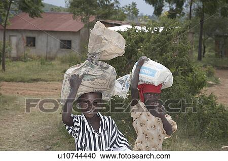 Stock Image -  food people child person children tanzania maize. Fotosearch