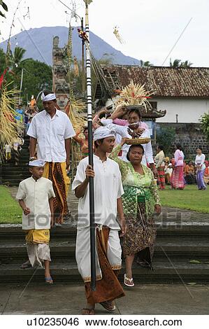 Stock Photograph -  food people person women indonesia carrying full. Fotosearch