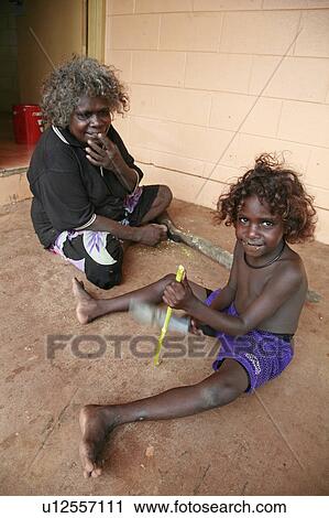 Stock Image -  girl child children home australia young mother . Fotosearch