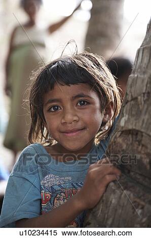 Stock Photography -  girl child face children timor leste kefua east. Fotosearch