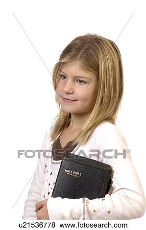 Stock Photo -  girl child face children young in studio bible 1. Fotosearch