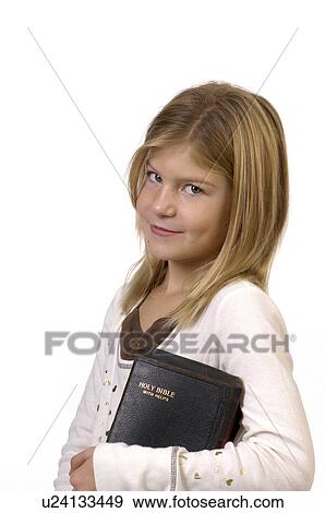 Stock Photo -  girl child face children young in studio bible 1. Fotosearch