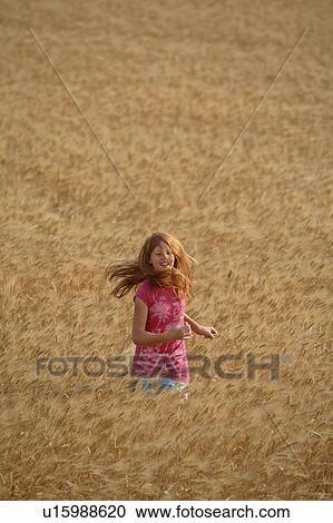 girl children redhead running through wheat crop View Large Photo Image Stock Image - girl children redhead running through wheat crop . Fotosearch