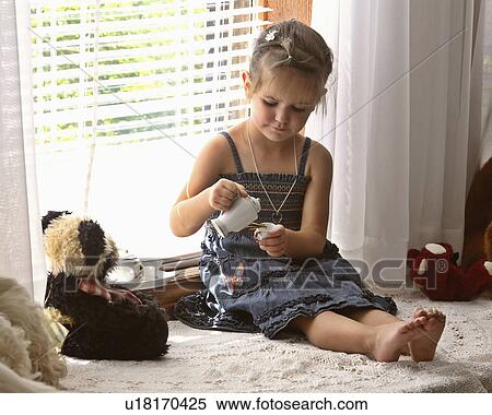 girl children sitting window serving tea young View Large Photo Image Stock Photography - girl children sitting window serving tea young. Fotosearch
