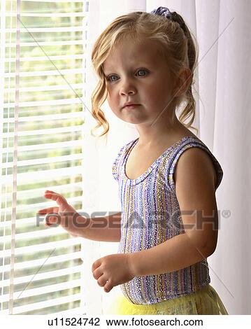 girl children standing window young venetian jaw View Large Photo Image Stock Image - girl children standing window young venetian jaw. Fotosearch