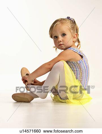 Stock Image -  girl dance children putting dancing shoe young. Fotosearch