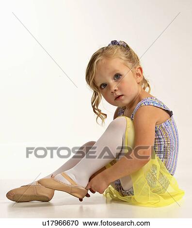 Stock Image -  girl dance children putting dancing shoe young. Fotosearch