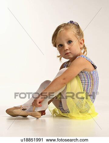 Stock Image -  girl dance children putting dancing shoe young. Fotosearch