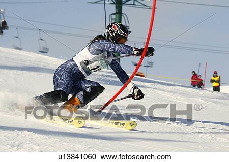 Stock Image -  girl winter teenage gate in slalom ski race girl . Fotosearch