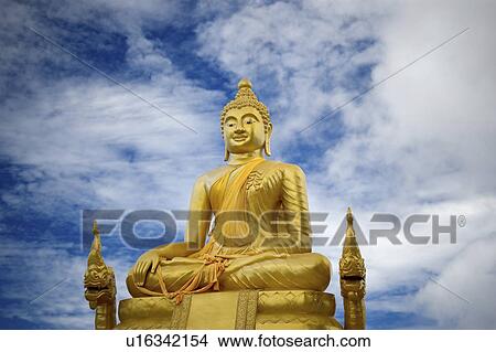 Picture -  gold buddha statue in phuket thailand golden. Fotosearch