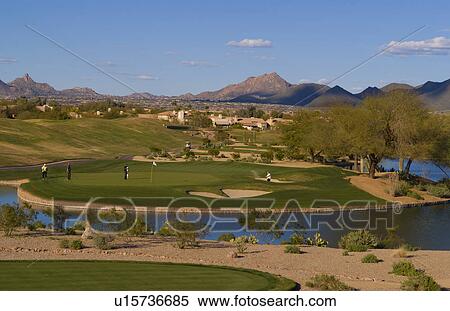 Stock Photography -  golf sport golfers playing 12th hole tournament. Fotosearch