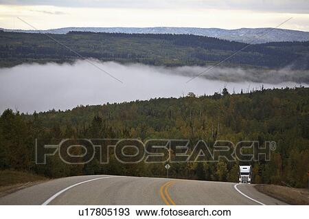 Stock Image -  ground fog in scenic alberta truck highway patch. Fotosearch