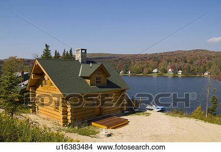 home log cabin in beautiful setting big lake View Large Photo Image Picture - home log cabin in beautiful setting big lake. Fotosearch