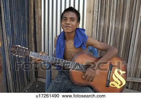 home timor leste boy playing guitar topu honis View Large Photo Image Stock Image - home timor leste boy playing guitar topu honis. Fotosearch
