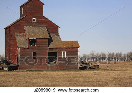 horse running behind wooden grain elevator old View Large Photo Image Stock Photo - horse running behind wooden grain elevator old . Fotosearch